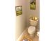 Cozy bathroom featuring tasteful wall art and decorative elements above the toilet at 11468 Captiva Kay Dr, Riverview, FL 33569