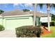 Inviting single-story home with a two-car garage, mature landscaping and lush lawn at 11468 Captiva Kay Dr, Riverview, FL 33569