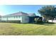 Backyard view of the house and the screened patio at 11468 Captiva Kay Dr, Riverview, FL 33569