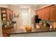 Well-equipped kitchen featuring rich wood cabinetry, stainless steel appliances, and a breakfast bar at 11468 Captiva Kay Dr, Riverview, FL 33569