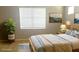 Serene bedroom with natural light, calm decor, and soft bedding at 11468 Captiva Kay Dr, Riverview, FL 33569