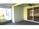 Covered patio featuring painted walls, ceiling fan, and sliding glass doors at 11468 Captiva Kay Dr, Riverview, FL 33569