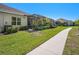 Beautifully landscaped backyard with a screened-in patio, ideal for relaxation and outdoor enjoyment at 13539 Circa Crossing Dr, Lithia, FL 33547