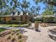 Charming clubhouse with a rustic design, surrounded by mature trees and landscaping at 13539 Circa Crossing Dr, Lithia, FL 33547