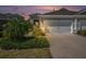 Charming townhome featuring an attached two-car garage and manicured landscaping at 13539 Circa Crossing Dr, Lithia, FL 33547