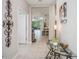 Welcoming foyer with tile flooring, neutral paint, and elegant decorative accents at 13539 Circa Crossing Dr, Lithia, FL 33547