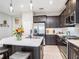 Modern kitchen with stainless steel appliances, a center island, and stylish pendant lighting at 13539 Circa Crossing Dr, Lithia, FL 33547