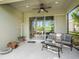 Relaxing outdoor patio with comfortable seating, ceiling fan and views of backyard at 13539 Circa Crossing Dr, Lithia, FL 33547
