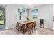 Bright dining area with table and chairs overlooking the backyard view at 13757 Wineberry Dr, Dade City, FL 33525