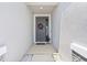 Inviting entryway with a decorative wreath, neutral colors, and stone accents at 13757 Wineberry Dr, Dade City, FL 33525