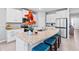 Kitchen featuring granite countertops, white cabinetry, and a center island with seating at 13757 Wineberry Dr, Dade City, FL 33525