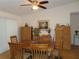 Formal dining room with a wooden table, seating for six, and decorative accents at 1395 Heather Ridge Blvd, Dunedin, FL 34698
