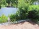 Lush garden area with a variety of plants, shrubs, and natural mulch at 1395 Heather Ridge Blvd, Dunedin, FL 34698