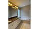 Large bathroom features double sinks, granite countertops, soaking tub and glass enclosed shower at 1415 Saddle Gold Ct, Brandon, FL 33511
