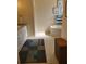 Serene bathroom featuring a soaking tub and a vanity with good storage options at 16106 Bridgedale Dr, Lithia, FL 33547