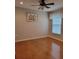 Bright bedroom with hardwood floors, a ceiling fan, and ample natural light at 16106 Bridgedale Dr, Lithia, FL 33547