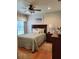 Charming bedroom with a comfortable bed, hardwood floors, and lots of natural light at 16106 Bridgedale Dr, Lithia, FL 33547