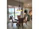 Dining area with sliding glass doors leading to the pool and backyard at 16106 Bridgedale Dr, Lithia, FL 33547