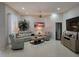 Inviting living room with neutral color palette and tile flooring at 16106 Bridgedale Dr, Lithia, FL 33547