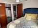 Bedroom featuring a ceiling fan, patterned bedding, throw pillows, and closet access at 1626 27Th N Ave, St Petersburg, FL 33713