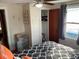 Bright bedroom featuring a ceiling fan, closet, chest of drawers, and window views at 1626 27Th N Ave, St Petersburg, FL 33713