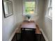 Cozy dining area with minimalist table, benches, and natural light at 1626 27Th N Ave, St Petersburg, FL 33713