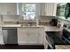 Bright kitchen featuring white cabinets, stone countertops and stainless steel appliances at 1626 27Th N Ave, St Petersburg, FL 33713