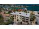 Coastal condo building with balconies, parking, and water views at 1700 Pass A Grille Way # 9, St Pete Beach, FL 33706