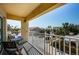 Relax on this inviting balcony with seating and enjoy panoramic views of the surrounding neighborhood at 1700 Pass A Grille Way # 9, St Pete Beach, FL 33706