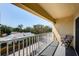 A serene balcony overlooking palm tree views; perfect for relaxation and enjoying the outdoors at 1700 Pass A Grille Way # 9, St Pete Beach, FL 33706