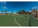 Outdoor basketball court surrounded by green space and palm trees on a sunny day at 1700 Pass A Grille Way # 9, St Pete Beach, FL 33706