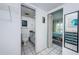 Clean bathroom with tile flooring and a vanity that connects the hall and bedroom at 1700 Pass A Grille Way # 9, St Pete Beach, FL 33706