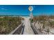 Beach access path with signage at 1700 Pass A Grille Way # 9, St Pete Beach, FL 33706