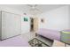 This room features twin beds, tile flooring, and a large closet for storage at 1700 Pass A Grille Way # 9, St Pete Beach, FL 33706