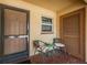 Unit entryway with a tiled floor, seating and unit number clearly visible at 1700 Pass A Grille Way # 9, St Pete Beach, FL 33706