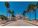 Grand pink hotel with manicured pathway and palm trees at 1700 Pass A Grille Way # 9, St Pete Beach, FL 33706