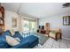 Living room features a comfortable sofa, balcony access, and neutral decor for a relaxing atmosphere at 1700 Pass A Grille Way # 9, St Pete Beach, FL 33706
