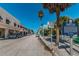 Charming street view featuring colorful buildings, palm trees, and historical markers at 1700 Pass A Grille Way # 9, St Pete Beach, FL 33706