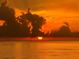 Amazing ocean sunset with cloudy skies and sun sinking below the horizon at 1700 Pass A Grille Way # 9, St Pete Beach, FL 33706