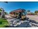 A colorful trolley is parked on the street, offering a convenient and charming way to explore the local area at 1700 Pass A Grille Way # 9, St Pete Beach, FL 33706