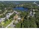 Property view from above nestled among trees with access to the water, outlined in red for better visibility at 17111 Mockingbird Ln, Lutz, FL 33548