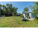 Shows the back yard of the house with green shed at 17111 Mockingbird Ln, Lutz, FL 33548