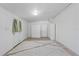 Finished basement with carpet, overhead lighting, storage wardrobe and exterior access at 17111 Mockingbird Ln, Lutz, FL 33548