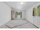 Bright finished basement space with overhead lighting and exterior access door at 17111 Mockingbird Ln, Lutz, FL 33548