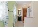 Bathroom with floral print curtains, uniquely-tiled shower, and light-colored walls at 17111 Mockingbird Ln, Lutz, FL 33548