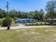 The home shows the front with landscaping and fencing at 17111 Mockingbird Ln, Lutz, FL 33548