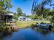 Charming home boasts waterfront access, with a tranquil pond and boat access for serene relaxation at 17111 Mockingbird Ln, Lutz, FL 33548