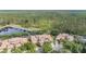 Beautiful aerial view of homes nestled amidst a tranquil lake and forest, offering a serene and picturesque setting at 17537 Fairmeadow Dr, Tampa, FL 33647