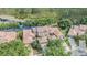 Gorgeous aerial view showcasing luxury homes near a tranquil lake and dense forest, blending nature and upscale living at 17537 Fairmeadow Dr, Tampa, FL 33647