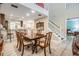 Elegant dining room boasts natural light, classic furniture, and seamless connection to the kitchen at 17537 Fairmeadow Dr, Tampa, FL 33647